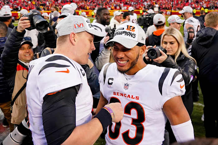 Jan 30, 2022; Kansas City, Missouri, USA; Cincinnati Bengals quarterback Joe Burrow (left) and wide receiver Tyler Boyd (83) celebrate after winning the AFC Championship Game against the Kansas City Chiefs at GEHA Field at Arrowhead Stadium. The Cincinnati Bengals won 27-24. Mandatory Credit: Jay Biggerstaff-USA TODAY Sports